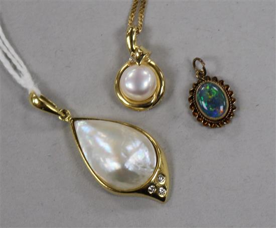 A modern,, 18ct gold, baroque cultured pearl and diamond pendant, a 9ct gold and cultured pearl pendant on a 9ct gold chain & a pendant